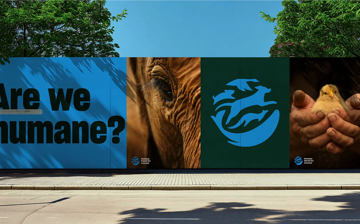 Are we humane? 가 적힌 옥외 광고와 새 로고